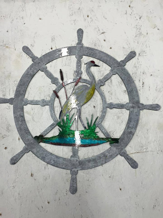 nautical wheel metal wall art with a CRANE